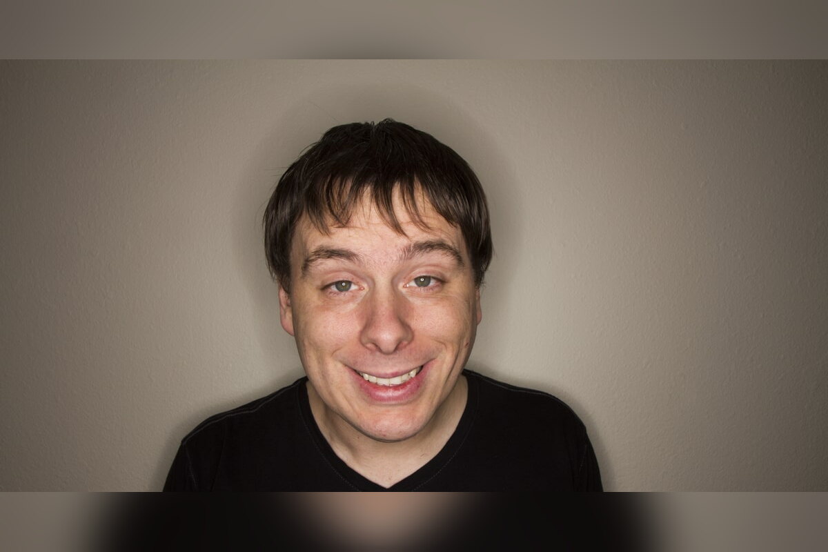 Grinning young man looking high