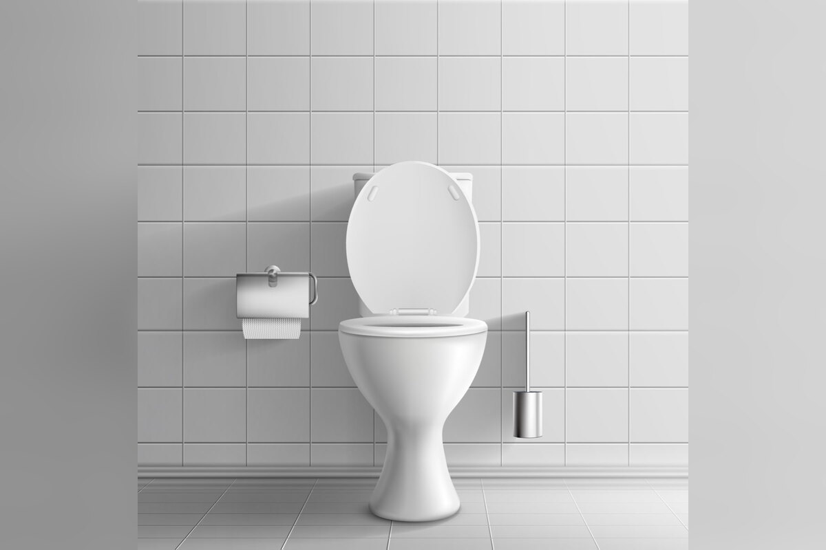White toilet in a tiled bathroom