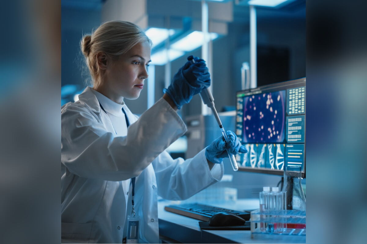 Scientist in a lab coat pipetting samples in a research laboratory