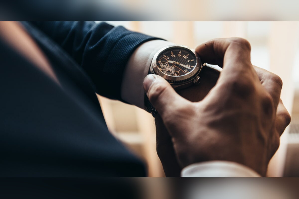 Man checking the time on his wristwatch