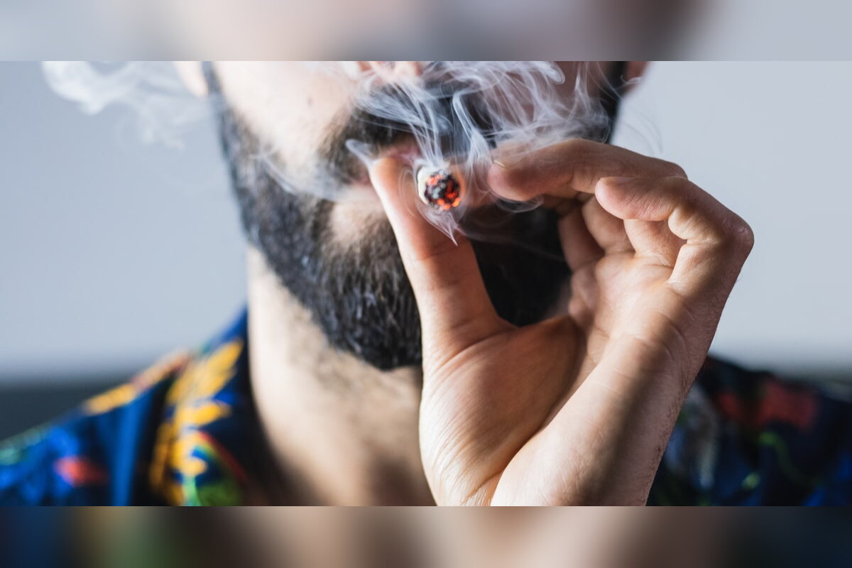 Bearded man smoking a joint