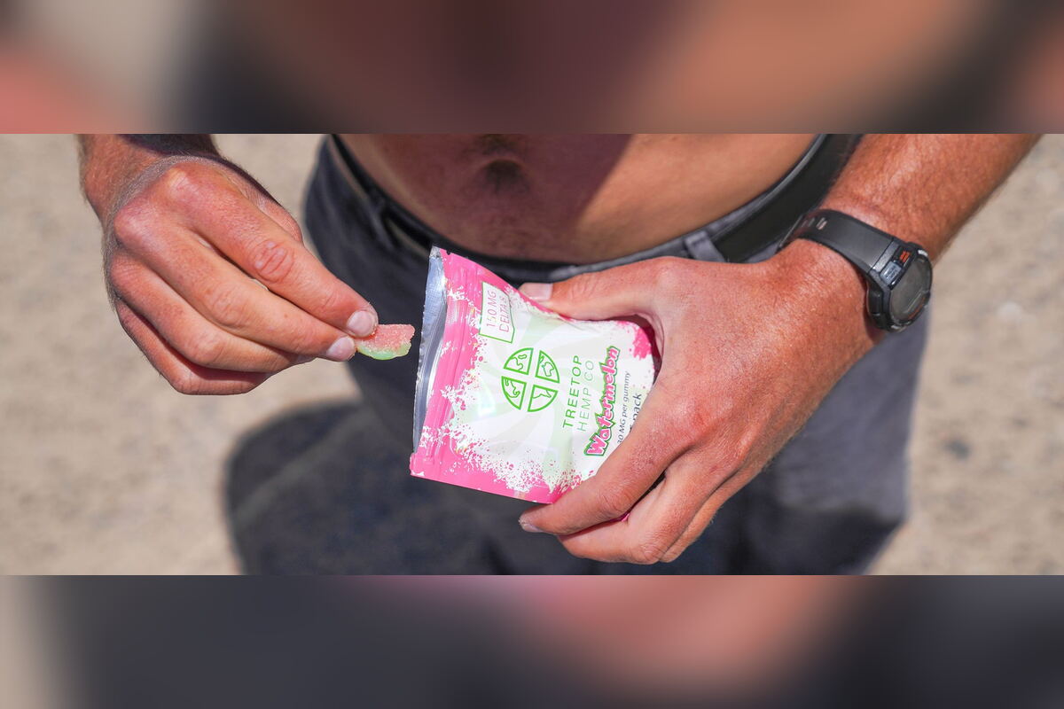 Man opening a Treetop Hemp Co delta-8 gummies pouch