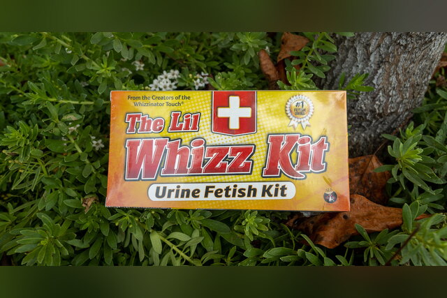 The Lil Whizz Kit urine kit box lying in green plants